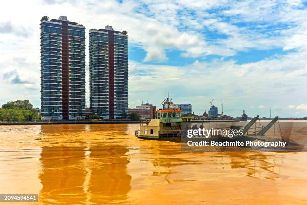 sibu city skyline with the passenger ferry crossing the rajang river in sibu, sarawak, malaysia - sibu river stock pictures, royalty-free photos & images