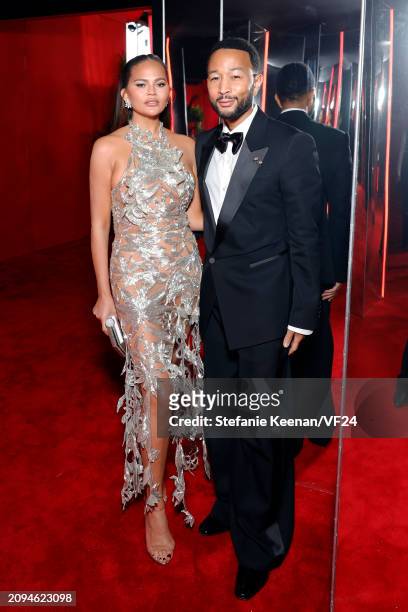 Chrissy Teigen and John Legend attend the 2024 Vanity Fair Oscar Party Hosted By Radhika Jones at Wallis Annenberg Center for the Performing Arts on...