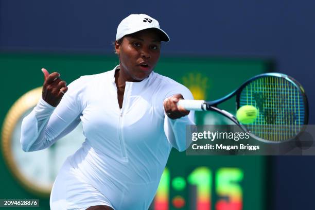 Taylor Townsend of the United States returns a shot to Emina Bektas of the United States during her women's singles qualifying match during the Miami...