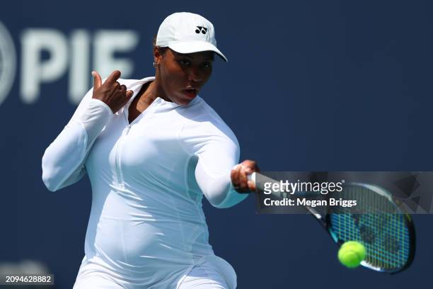 Taylor Townsend of the United States returns a shot to Emina Bektas of the United States during her women's singles qualifying match during the Miami...