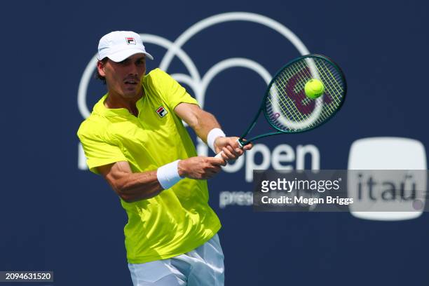 Patrick Kypson of the United States returns a shot to Aleksandar Kovacevic of the United States during his men's singles qualifying match during the...