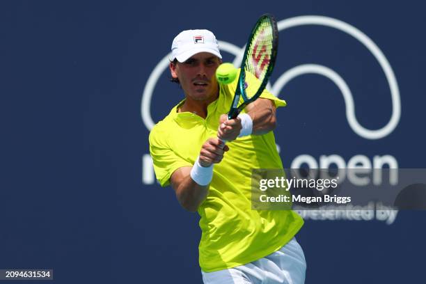 Patrick Kypson of the United States returns a shot to Aleksandar Kovacevic of the United States during his men's singles qualifying match during the...