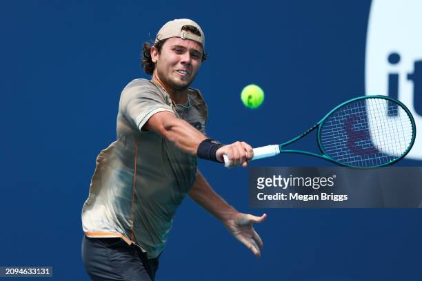 Aleksandar Kovacevic of the United States returns a shot to Patrick Kypson of the United States during his men's singles qualifying match during the...
