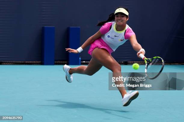 Alexandra Eala of Philippines returns a shot to Emiliana Arango of Colombia during her women's singles qualifying match during the Miami Open at Hard...