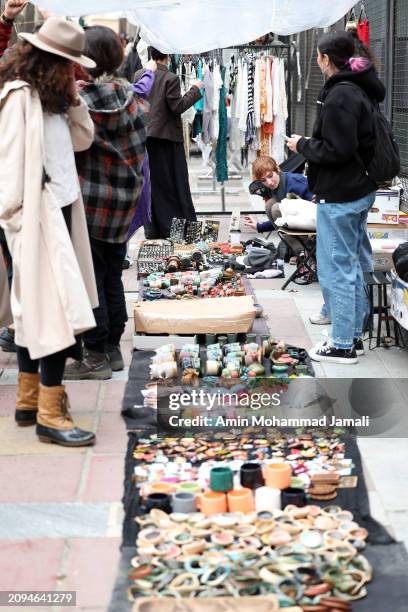 People prepare for the Persian New Year on March 18, 2024 in Tehran, Iran. Nowruz is the Iranian or Persian New Year celebrated by various...