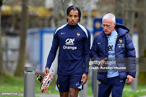 Jules Kounde and Didier Deschamps speak as they arrive to a French national team training session part of a preparation for upcoming friendly...