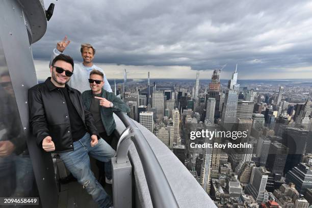 Shane Filan, Kian Egan and Nicky Byrne of Westlife pose as Minister Helen McEntee lights the Empire State Building in celebration of St. Patrick's...