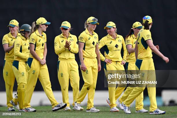Australia's cricketers celebrate after winning the the first one-day international women cricket match between Bangladesh and Australia at...