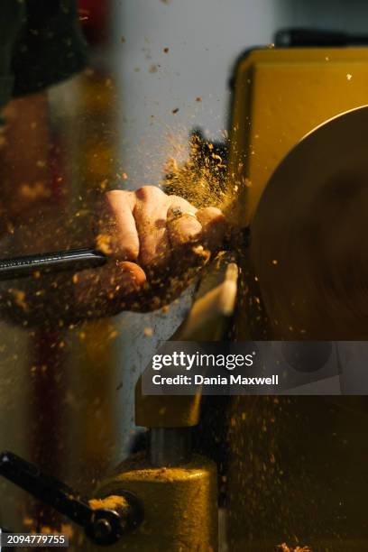 Artisan Julie Jackson is photographed using a woodturner in her studio for Los Angeles Times on April 5, 2023 in Los Angeles, California. Jackson's...