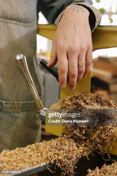 Artisan Julie Jackson is photographed surrounded by fallen shavings for Los Angeles Times on April 5, 2023 in Los Angeles, California. Jackson's...