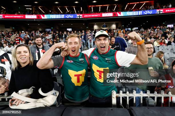 Tasmania Devils fans Bradley Cox-Goodyear and Will Tatchell pose for a photograph during the 2024 AFL Round 02 match between the St Kilda Saints and...