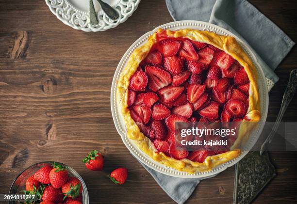 preparing strawberry galette or open strawberry pie - strawberry tart stock pictures, royalty-free photos & images