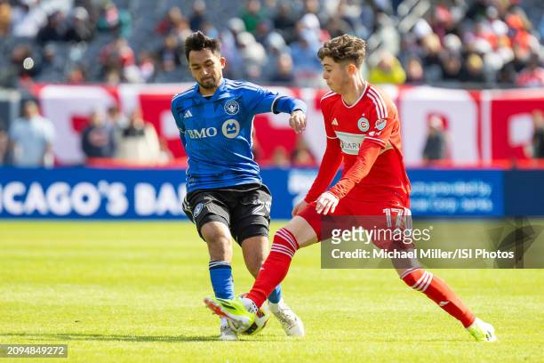 Mathieu Choiniere of CF Montreal battles for the ball with Brian Gutierrez of Chicago Fire during a game between CF Montreal and Chicago Fire FC at...