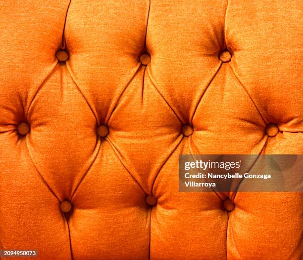 antique bright orange-coloured velvet upholstery on a chair - mississauga stock pictures, royalty-free photos & images