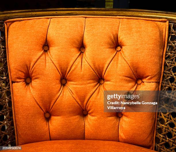 antique bright orange-coloured velvet upholstery on a chair - mississauga stock pictures, royalty-free photos & images