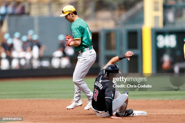 Albert Almora Jr. #8 of the Arizona Diamondbacks is forced out at second base by Hoy Park of the Oakland Athletics during the second inning of a...