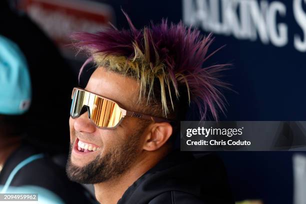 Lourdes Gurriel Jr. #12 of the Arizona Diamondbacks looks on from the dugout during a spring training game against the Oakland Athletics at Salt...