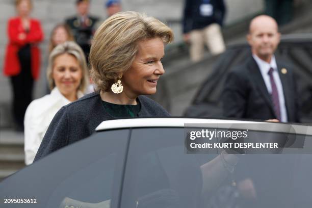 Queen Mathilde of Belgium stands next to a vehicle during a royal visit to the '24 years of the Women, Peace and Security Agenda, time for...