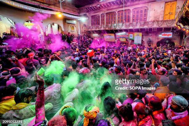 Hindu devotees are seen throwing colourful powders inside the Radha Ballav Temple of Vrindavan. The Radha Ballav Temple is an important Hindu temple...