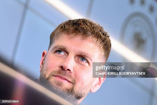 Germany's forward Niclas Fuellkrug attends a press conference after a training session of the German national football team on March 21, 2024 in...