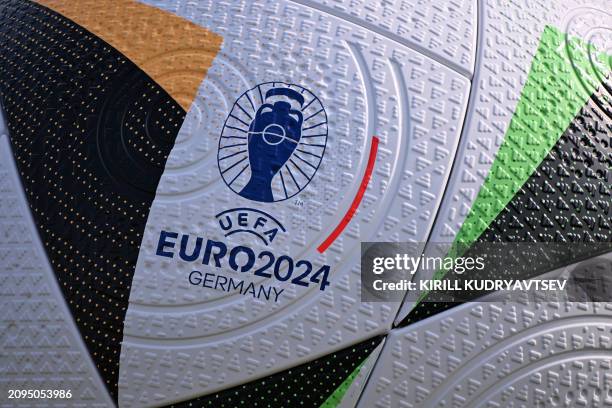 Logo is pictured on a giant replica ball after a training session of the German national football team on March 21, 2024 in Frankfurt am Main,...