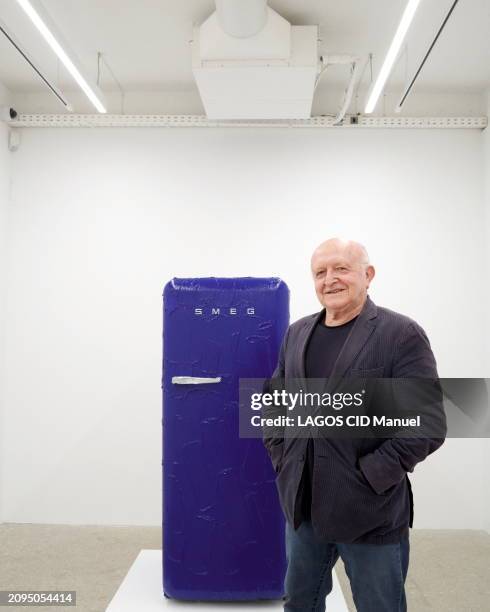 The artist Bertrand Lavier is photographed for Paris Match posing next to his "Smeg" work, a fridge covered in a thick layer of blue for his...