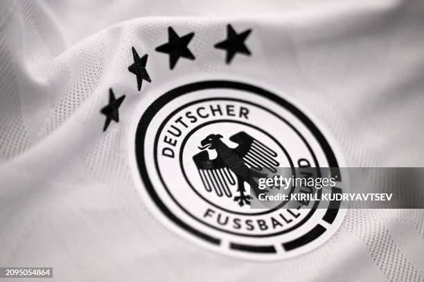 The German Football Association logo is pictured on a jersey after a training session of the German national football team on March 21, 2024 in...