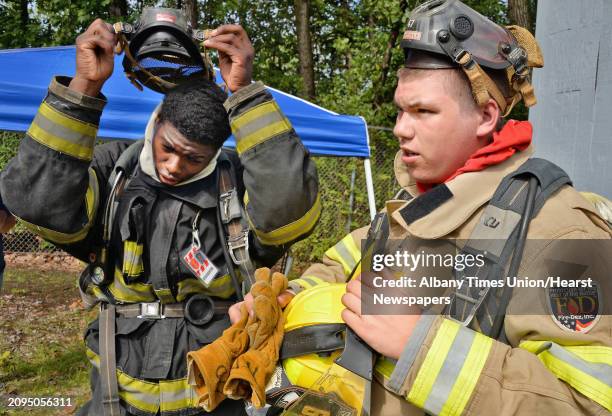 Roshane Murray, left of Hudson and Bryce Premo, 17 of Fairville after a search and rescue drill during the FiremenÕs Association of the State of New...