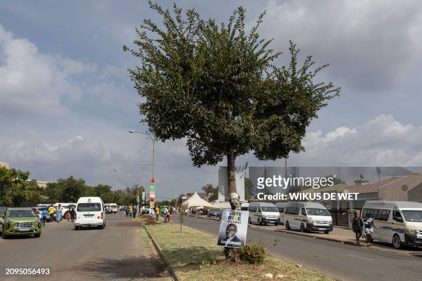 An election poster for South African political part Rise Mzansi hangs on a tree in Sharpeville on March 21, 2024 ahead of the South African...