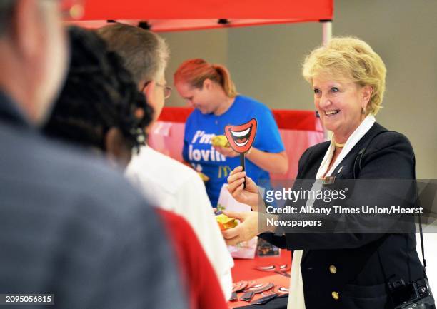 Kathie Reeher, owner of McDonalds at the Empire State Plaza hands out free Egg McMuffins during All Day Breakfast with Eggstravaganza at Empire State...
