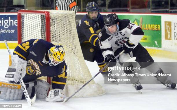 Union's Mike Vecchione, right, can't sneak his shot past Quinnpiac goalie Michael Garteig during Saturday's game against at Messa Rink Feb. 20, 2016...