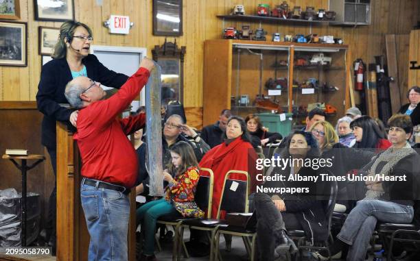 Dolores Meissner, left, presides over Saturday's auction at Meissner's Auction Service March 19, 2016 in New Lebanon, NY.