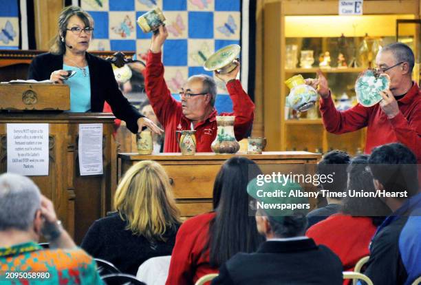 Dolores Meissner, left, presides over Saturday's auction at Meissner's Auction Service March 19, 2016 in New Lebanon, NY.