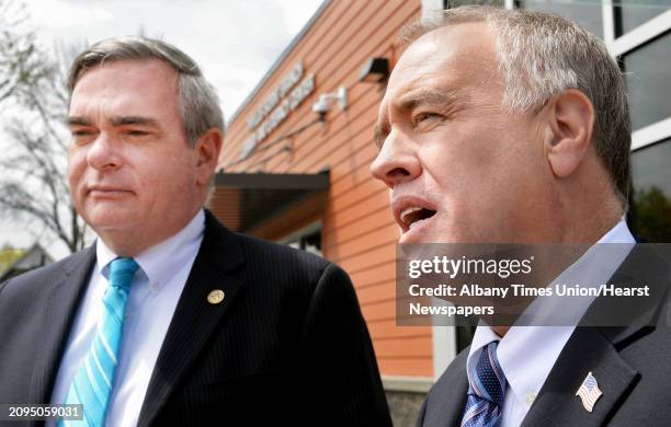 Mayor Gary McCarthy, left, and NYS Comptroller Thomas DiNapoli, left, speak with reporters following a tour of the newly opened Phyllis Bornt Branch...