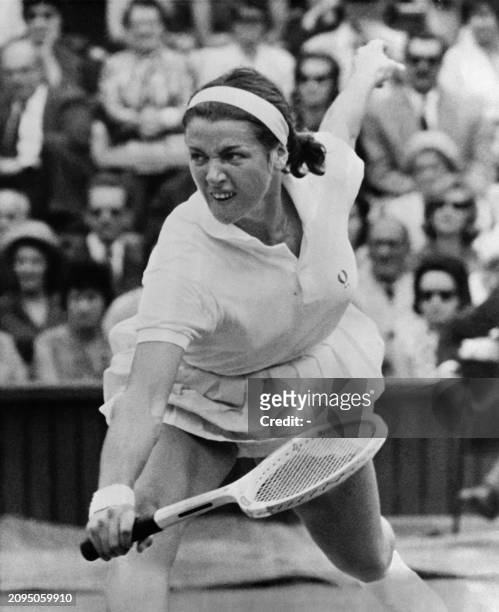Australian tennis player Margaret Smith-Court stretches to reach for the ball during a match at the Wimbledon championship held in London, on July,...