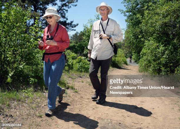 Becky, left, and John Peplinski of State College, Penn., look for Karner blue butterflies on the trails at the Pine Bush Discovery Center Tuesday May...