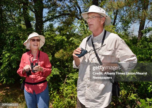 Becky and John Peplinski of State College, Penn., look for Karner blue butterflies on the trails at the Pine Bush Discovery Center Tuesday May 31,...