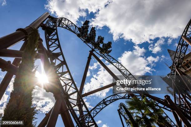 March 2024, Baden-Württemberg, Rust: A carriage of the new "Voltron Nevera" roller coaster travels along the tracks loaded with water dummies. The...