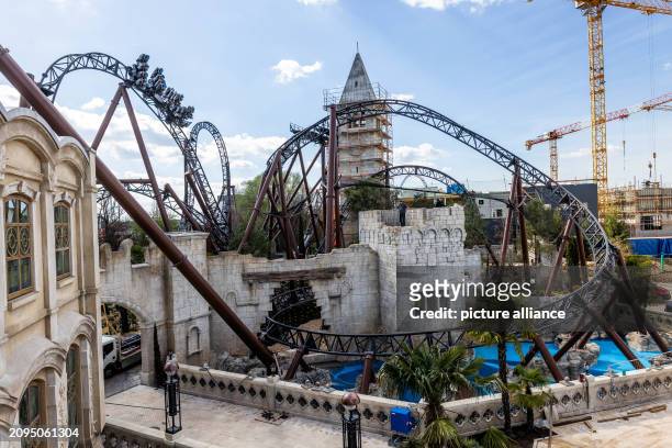 March 2024, Baden-Württemberg, Rust: A carriage of the new "Voltron Nevera" roller coaster travels along the tracks loaded with water dummies. The...