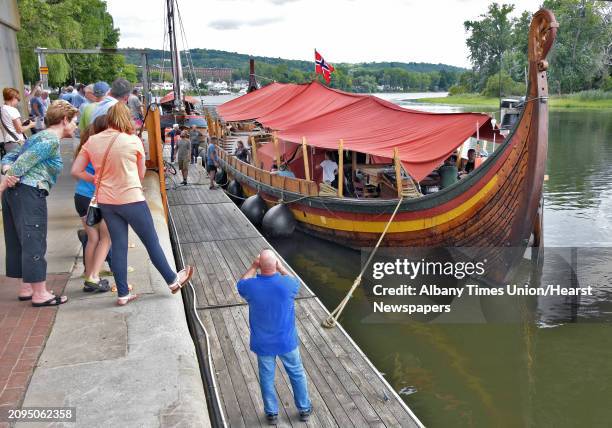 The crew of the world's largest Viking ship sailing in modern times, the Draken Harald Hårfagre settle in for a night's mooring on the Mohawk River...