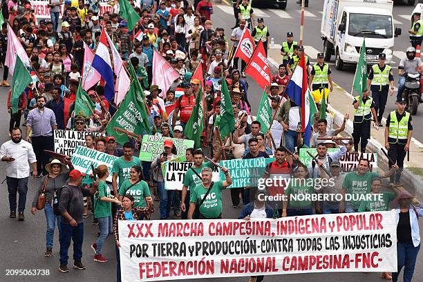 Peasants and indigenous people attend the annual peasants' march organized by the National Peasant Federation in Asuncion on March 21, 2024.