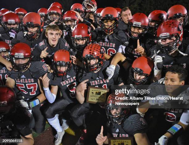 Glens Falls players celebrate their team win in the Class B state semifinal football game against Pleasantville at Dietz Stadium Saturday Nov. 19,...