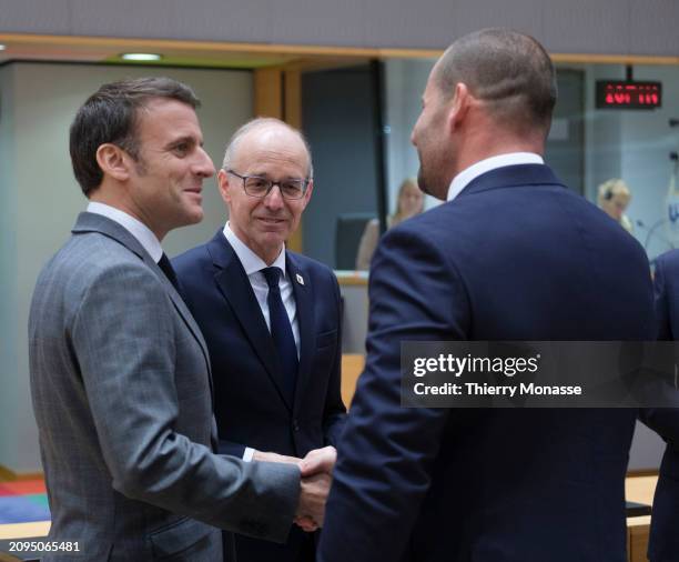 French President Emmanuel Macron is talking with the Luxembourg Prime Minister Luc Frieden and the Maltese Prime Minister Robert Abela prior the...