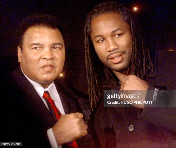 American Boxer Muhamed Ali poses with British colleague Lennox Lewis at the launch of a new Playstation game called "Knockout Kings" in London, 15...
