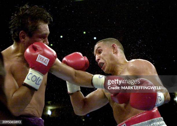 Hector Camacho from Puerto Rico backs Roberto Duran of Panama across the ring in a flurry of punches during their NBA Super Middle Weight fight held...
