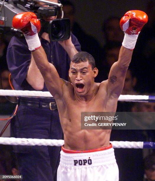 World WBO Super featherweight champion Acelino Freitas of Bahia, Brazil, screams with joy after knocking out Daniel Alicea of Puerto Rico in the...