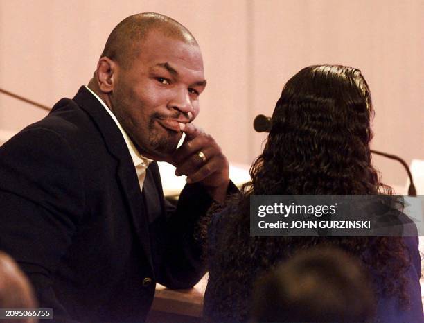 Former world heavyweight champion Mike Tyson looks back at a team of doctors as they testify before the Nevada State Athletic Commission 19 October...