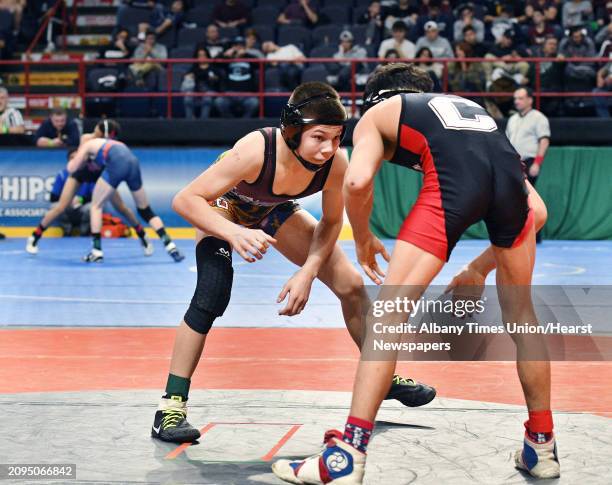 South Glens Falls' Brock Delsignore wrestles Terry Adams, right, of Staten Island during the State Wrestling Championships at the Times Union Center...