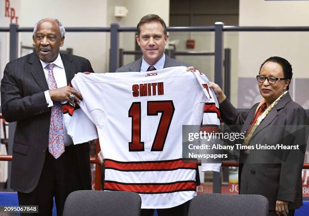 Director of athletics, Dr. Lee McElroy Jr., left, and RPI president Shirley Ann Jackson, right, welcome Dave Smith as RPI's new men's hockey coach...