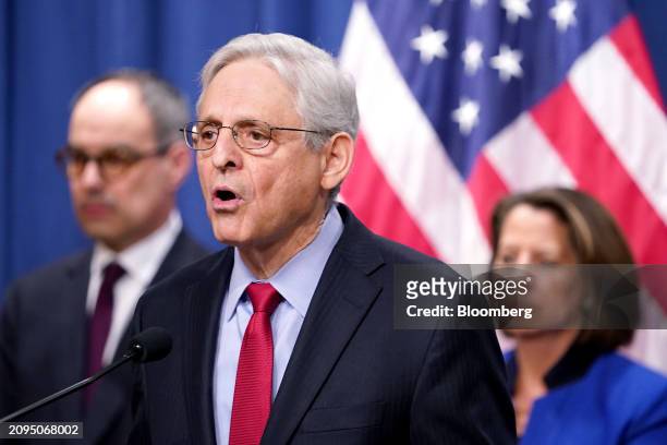 Merrick Garland, US attorney general, center, during a news conference at the Department of Justice in Washington, DC, US, on Thursday, March 21,...